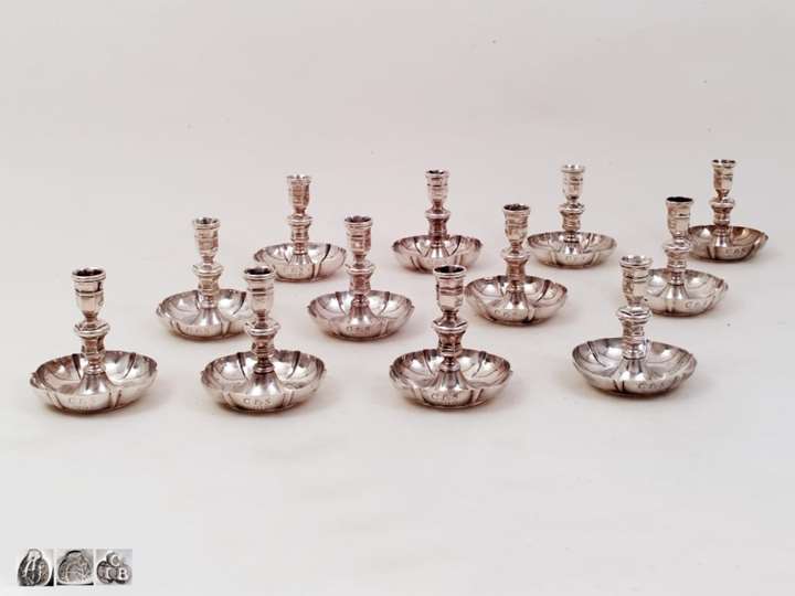 A Set of Twelve Silver Charming Charles VI Candlesticks from Vienna